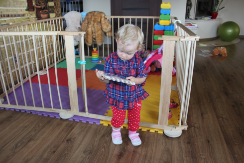 A baby interested in books